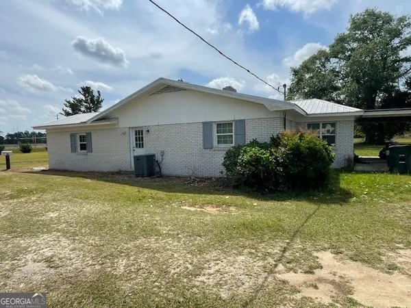 a house view with a garden space