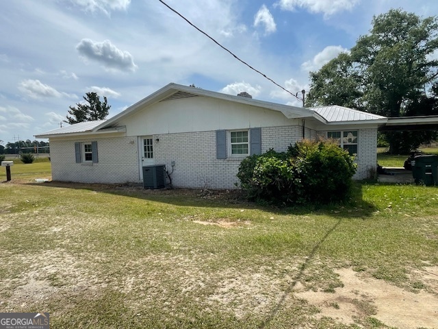 16877 Highway 129 Cobbtown, GA 30420 - Photo 5 of 45 a house view with a garden space