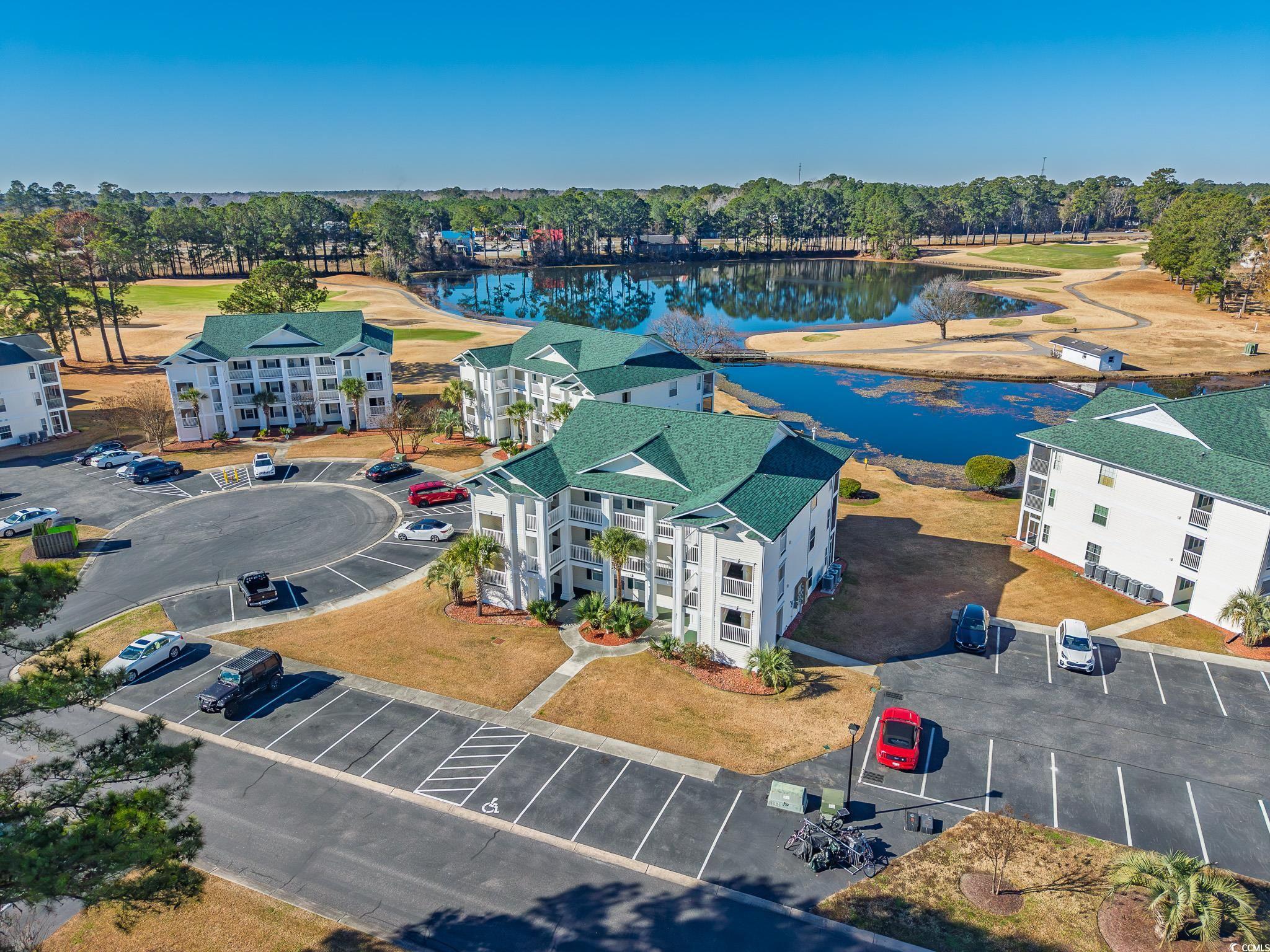 673 Tupelo Lane, Unit 19H Longs, SC 29568 - Photo 14 of 22 Bird's eye view of a large body of water and a local golf course