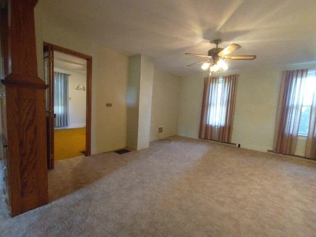 9101 North Church Road Davis, IL 61019 - Photo 14 of 38 an empty room with windows and fan