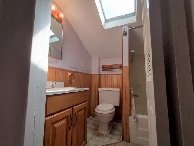 9101 North Church Road Davis, IL 61019 - Photo 18 of 38 a bathroom with a toilet a sink and mirror