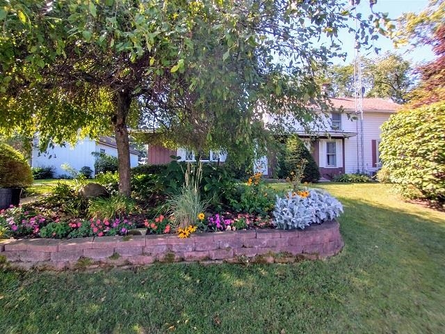 9101 North Church Road Davis, IL 61019 - Photo 3 of 38 a view of a garden with a house