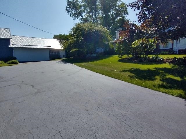 9101 North Church Road Davis, IL 61019 - Photo 34 of 38 a house view with a garden space