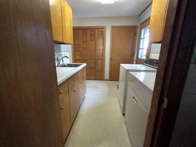 9101 North Church Road Davis, IL 61019 - Photo 6 of 38 a kitchen with a sink stove and cabinets