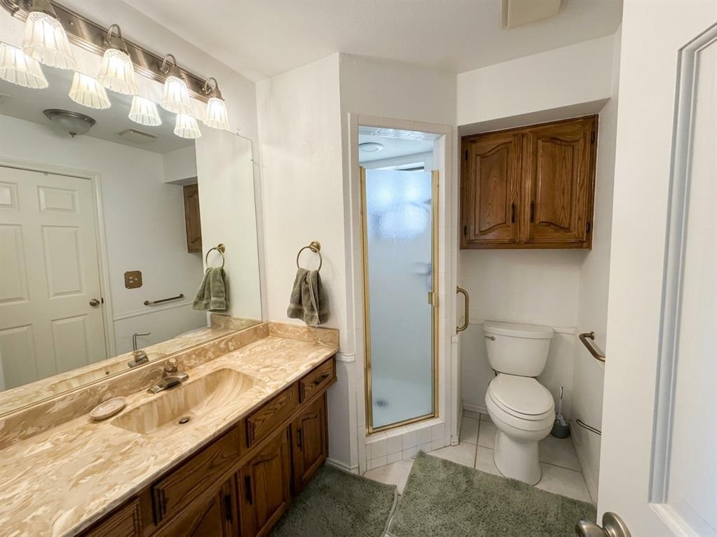 4307 Quail Hollow Road Dallas, TX 75287 - Photo 7 of 30 Full downstairs bathroom with vanity