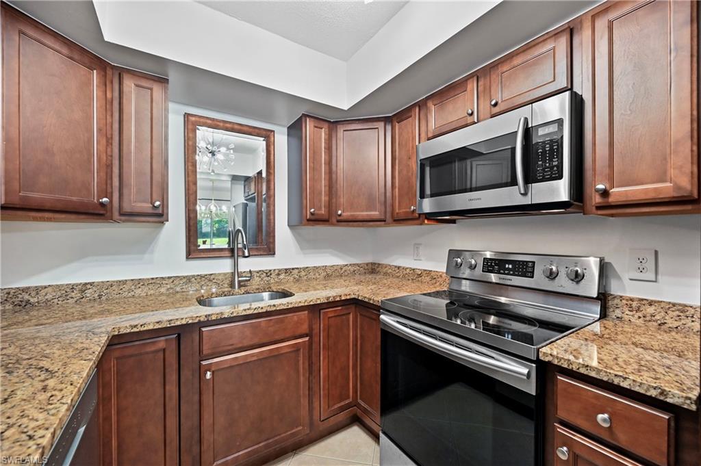 146 Harrison Road, Unit K1 Naples, FL 34112 - Photo 16 of 44 Big Modern Kitchen with wood cabinets