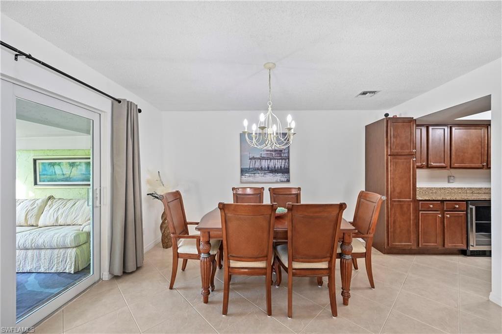 146 Harrison Road, Unit K1 Naples, FL 34112 - Photo 22 of 44 Leads out to glass 4 season Lanai