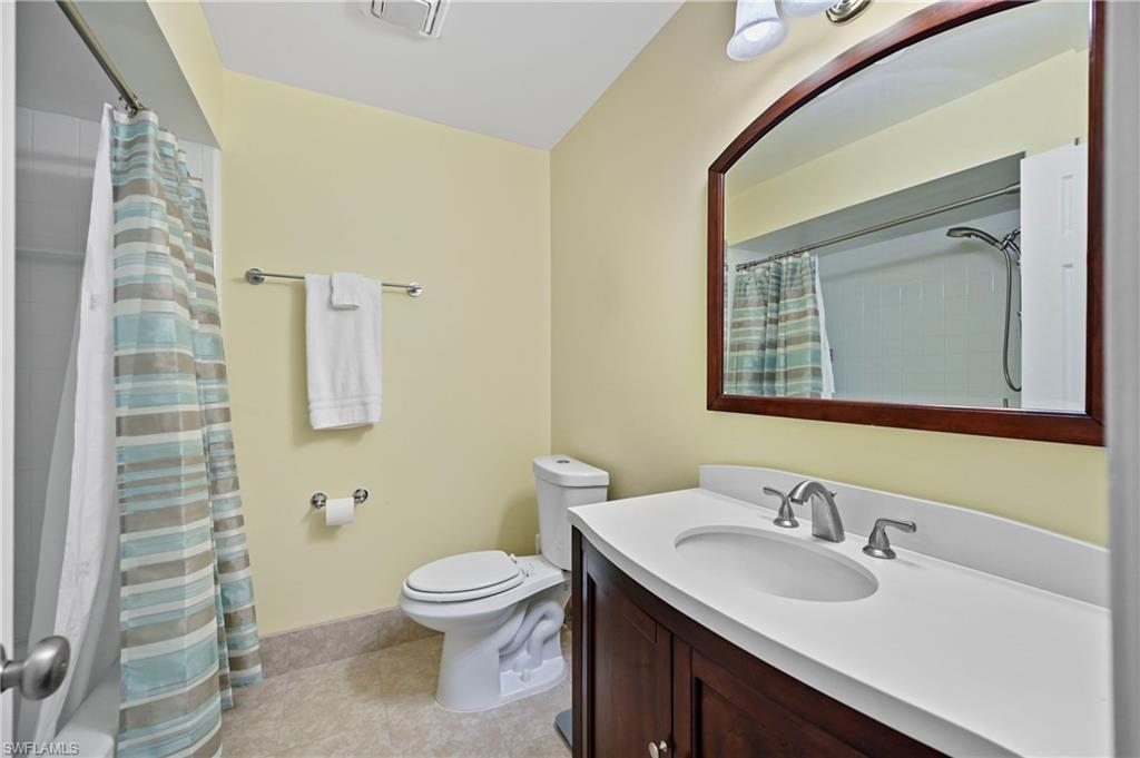 146 Harrison Road, Unit K1 Naples, FL 34112 - Photo 35 of 44 Guest Bath with white tile