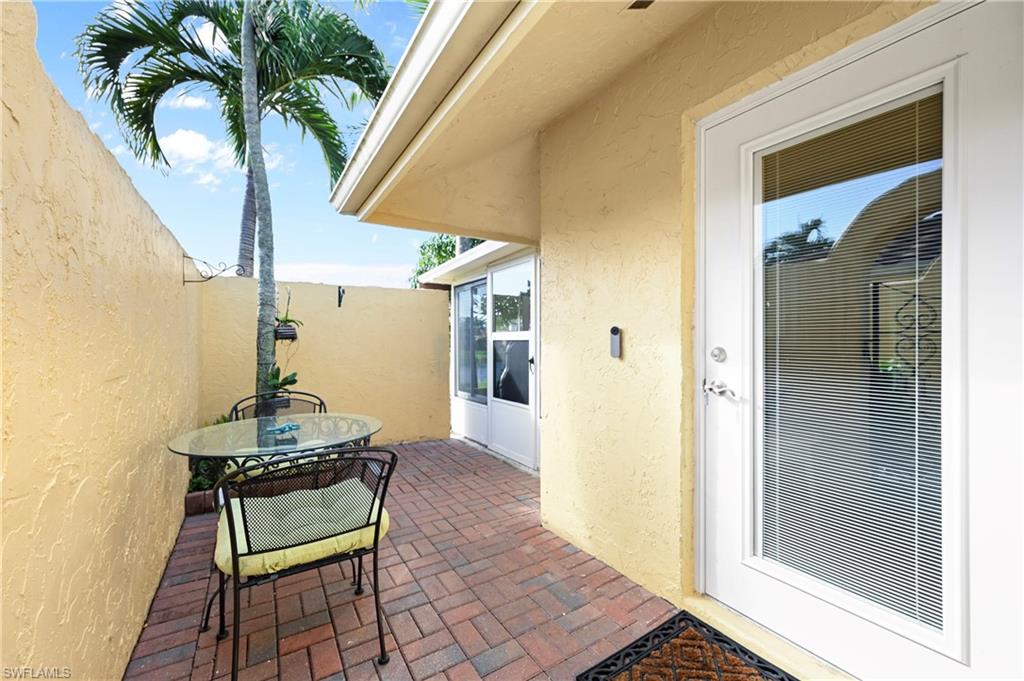 146 Harrison Road, Unit K1 Naples, FL 34112 - Photo 37 of 44 Closed Lanai for dining #3