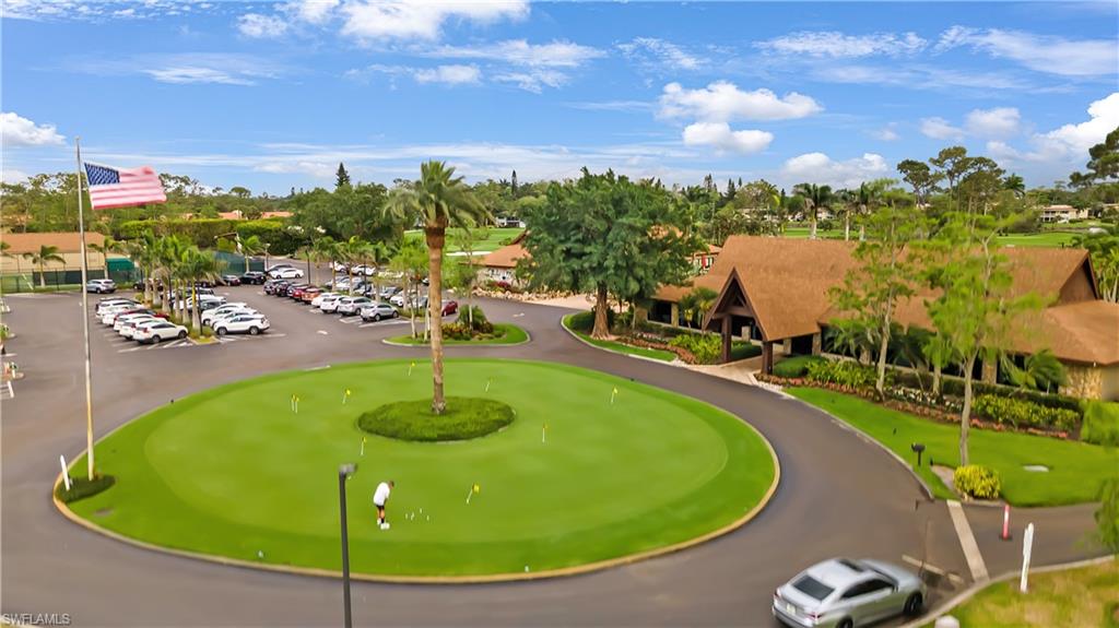 146 Harrison Road, Unit K1 Naples, FL 34112 - Photo 9 of 44 Putting Green and Main Club House with restaurant