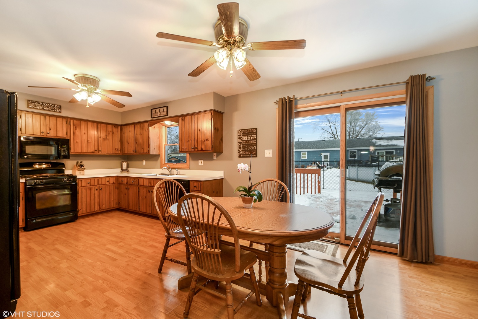 921 Barnside Road New Lenox, IL 60451 - Photo 9 of 27 a kitchen with a dining table chairs stainless steel appliances and cabinets