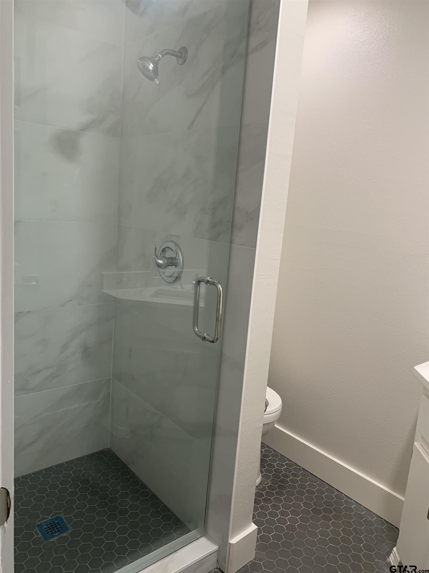 224 Miller Road Scroggins, TX 75480 - Photo 11 of 24 a bathroom with a shower