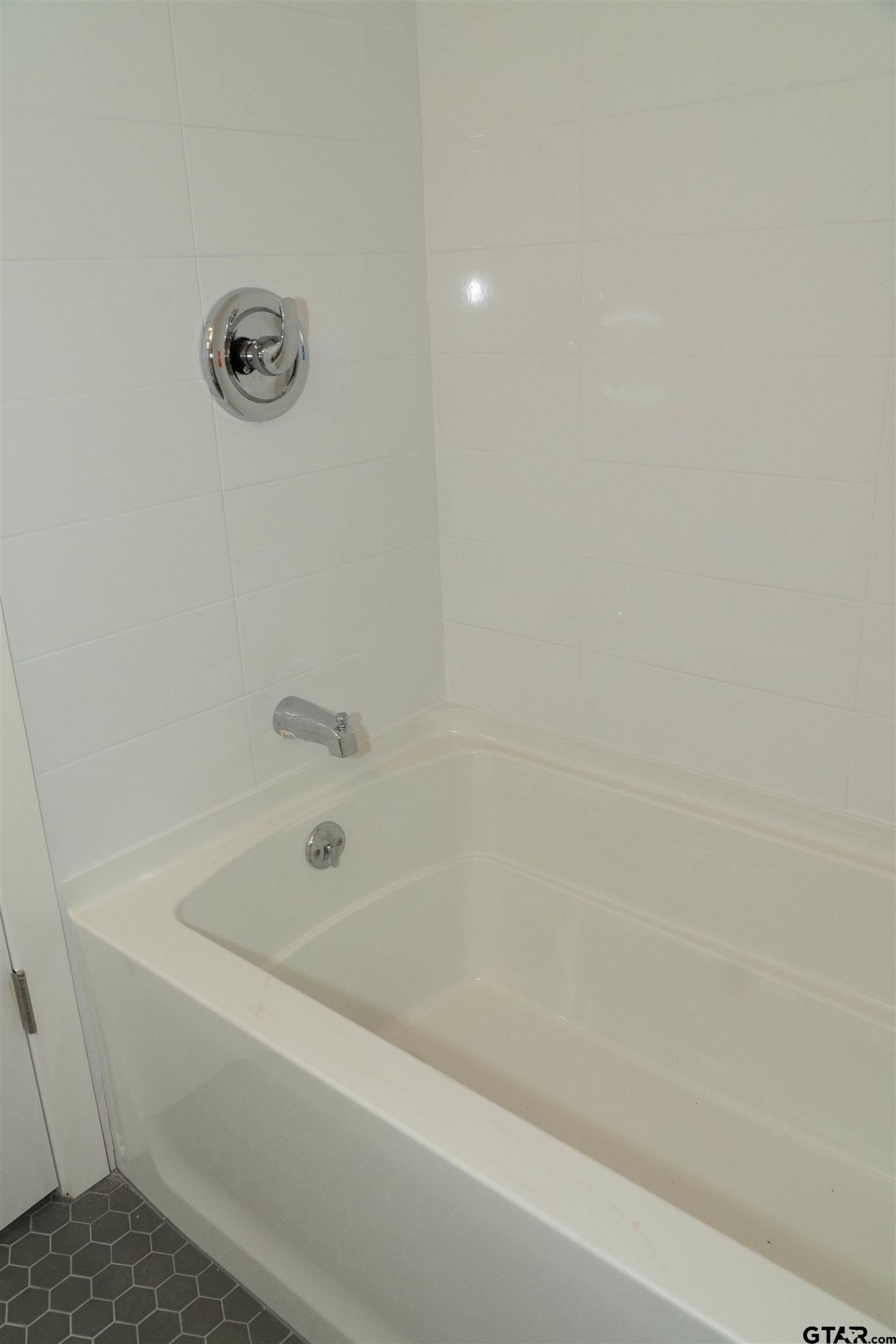 224 Miller Road Scroggins, TX 75480 - Photo 15 of 24 a bathroom with a bathtub