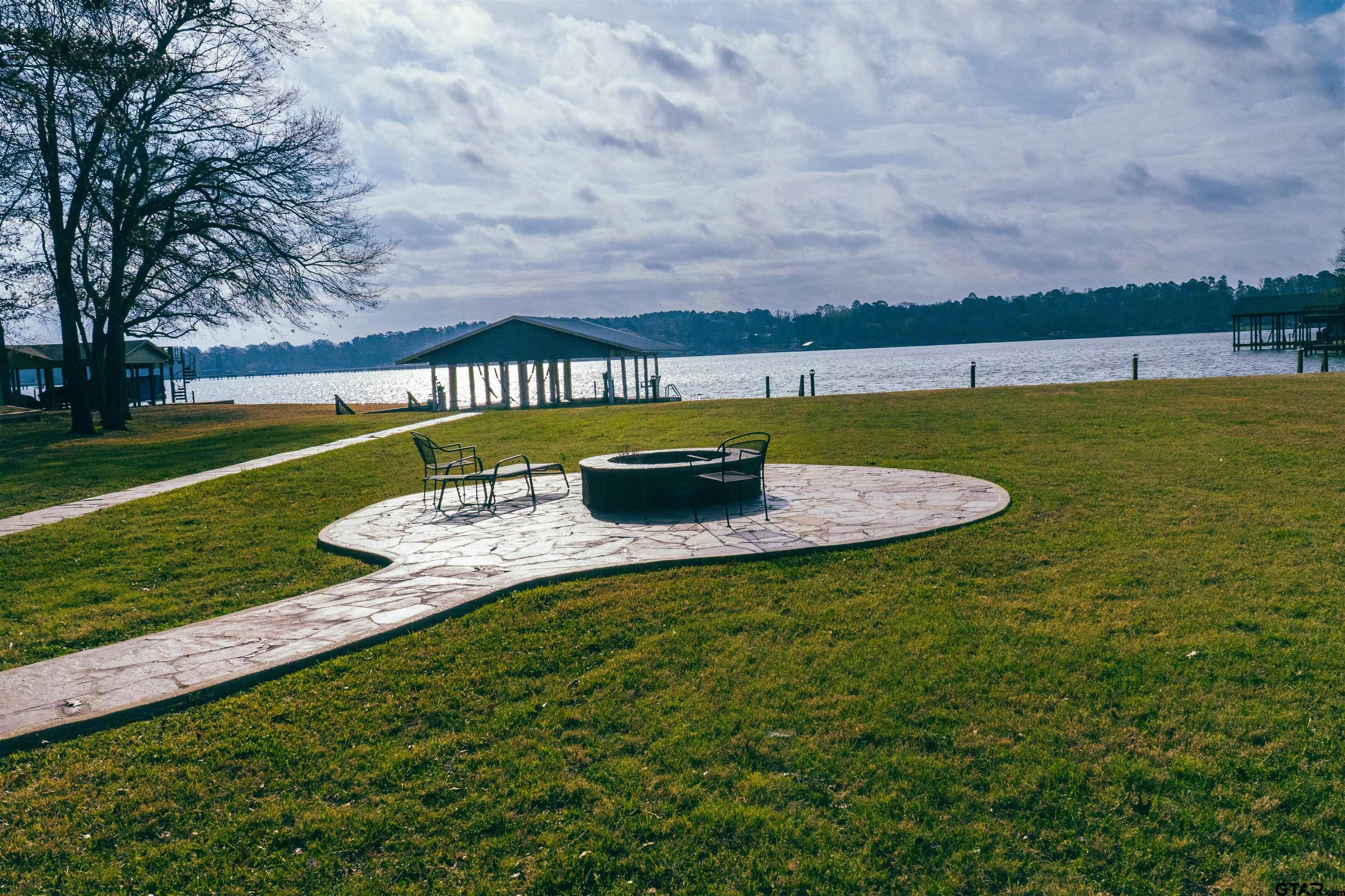 224 Miller Road Scroggins, TX 75480 - Photo 20 of 24 a view of a lake with a big yard