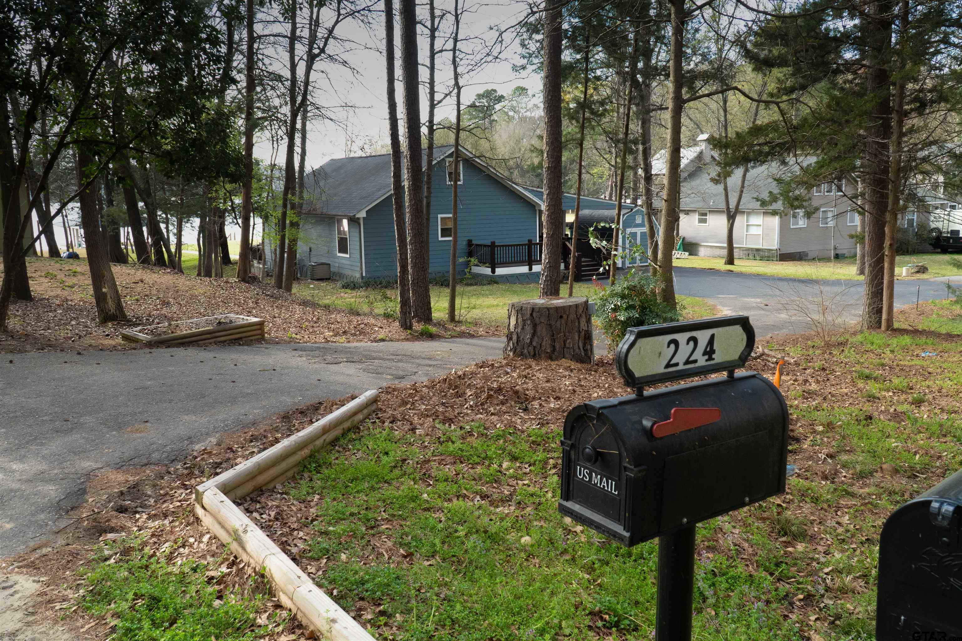 224 Miller Road Scroggins, TX 75480 - Photo 2 of 24 a view of backyard with tree