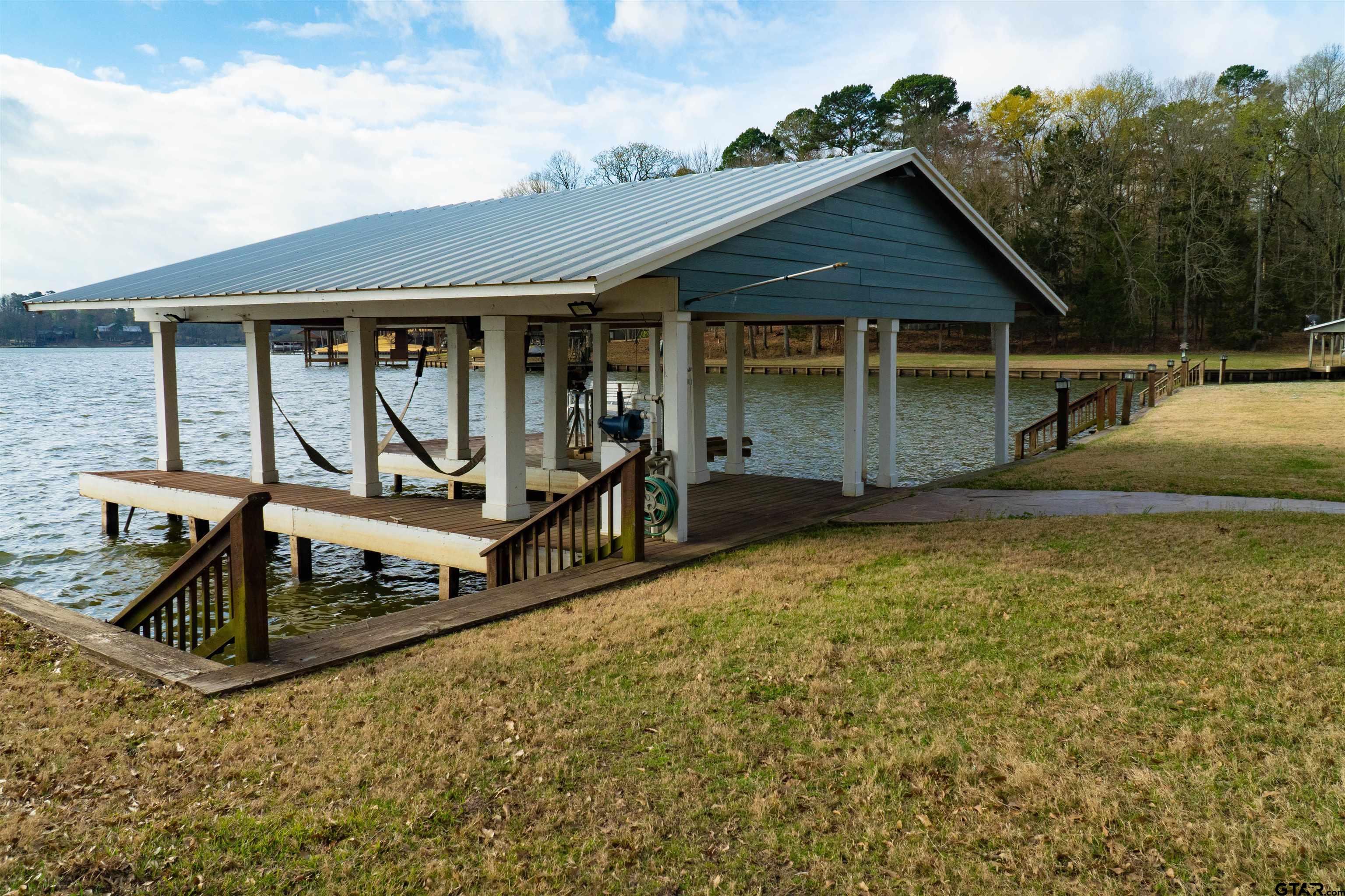 224 Miller Road Scroggins, TX 75480 - Photo 22 of 24 a front view of a house with a yard