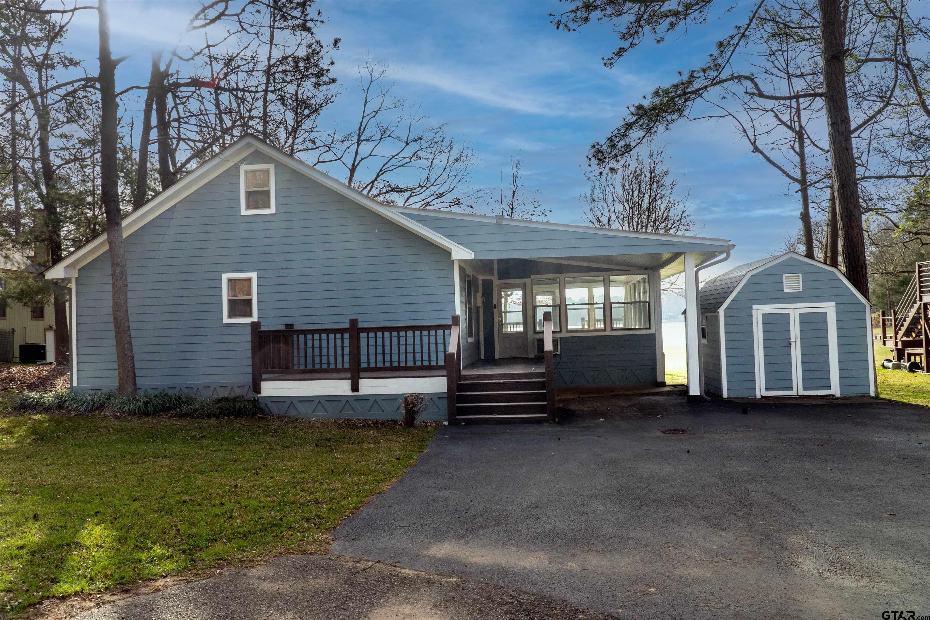 224 Miller Road Scroggins, TX 75480 - Photo 3 of 24 a view of a house with a yard