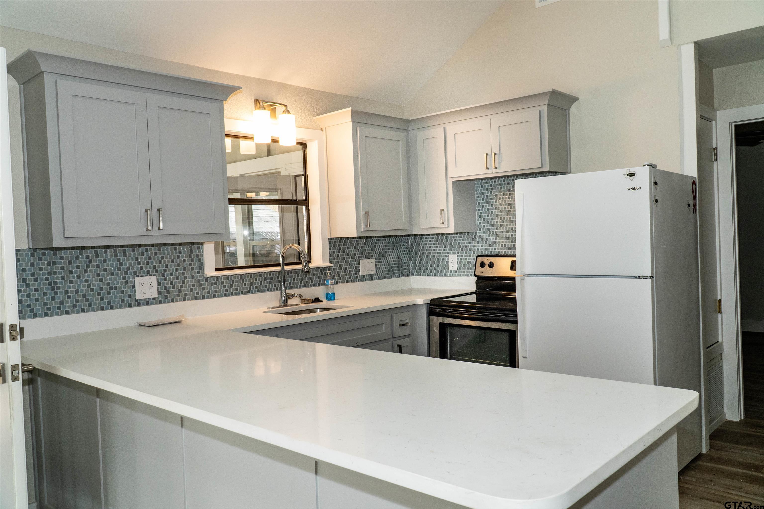 224 Miller Road Scroggins, TX 75480 - Photo 8 of 24 a kitchen with a refrigerator a sink and a stove