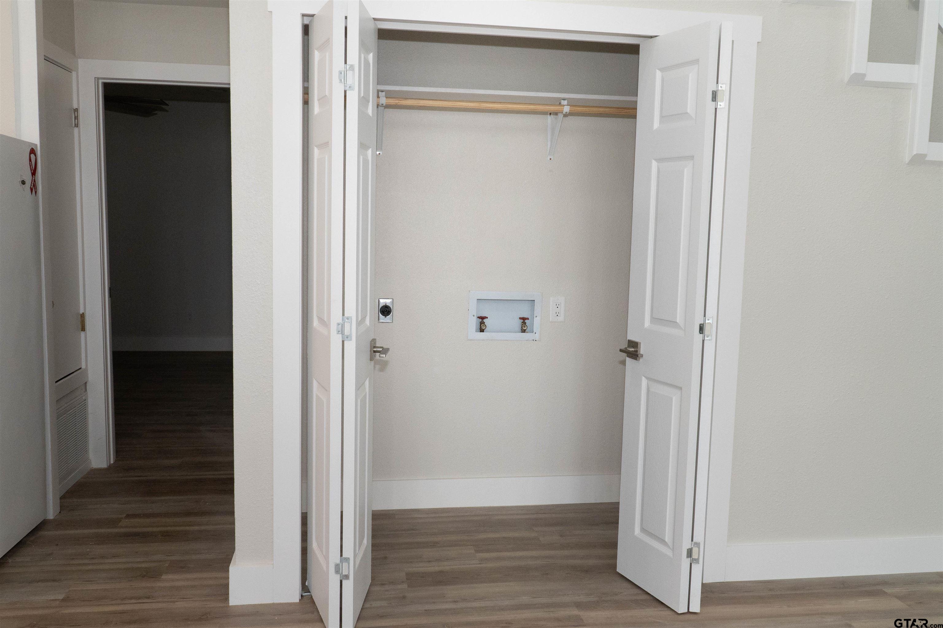 224 Miller Road Scroggins, TX 75480 - Photo 9 of 24 a view of a hallway with wooden floor