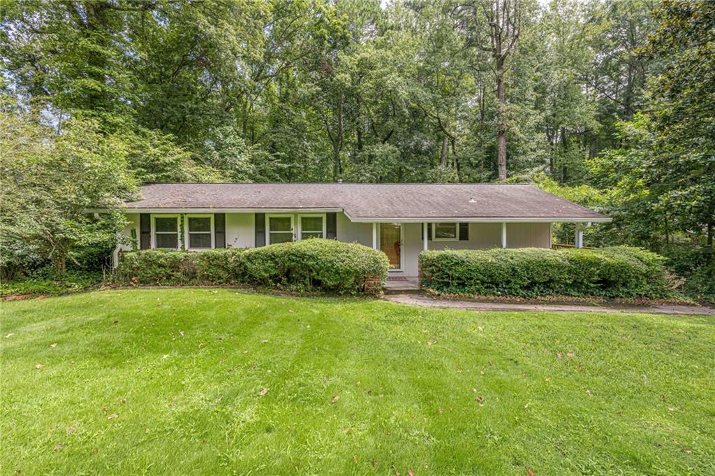 3671 Cold Spring Lane Atlanta, GA 30341 - Photo 1 of 26 a front view of a house with a yard