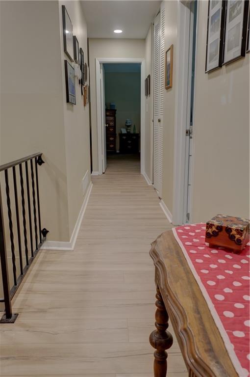 3671 Cold Spring Lane Atlanta, GA 30341 - Photo 12 of 26 a bedroom with a bed and a chandelier