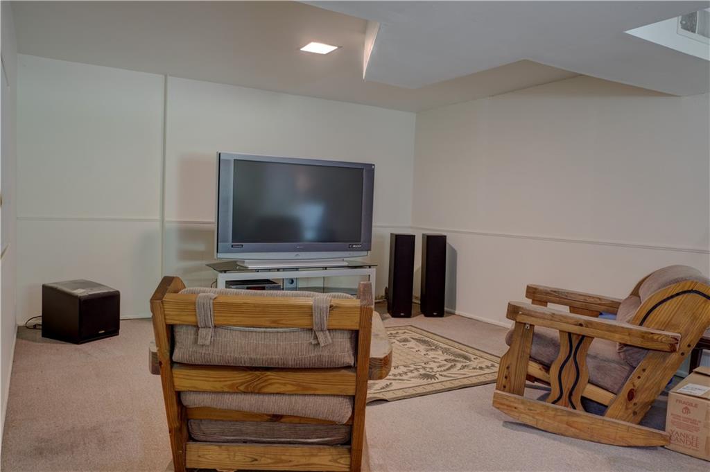 3671 Cold Spring Lane Atlanta, GA 30341 - Photo 19 of 26 a living room with furniture and a flat screen tv
