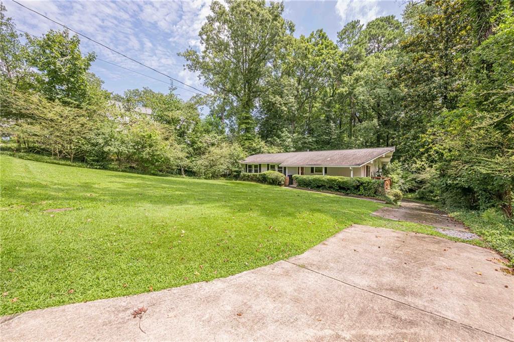 3671 Cold Spring Lane Atlanta, GA 30341 - Photo 2 of 26 a view of a park with large trees