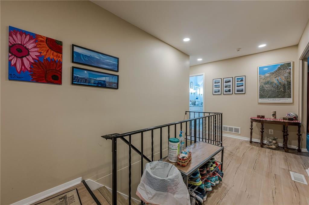 3671 Cold Spring Lane Atlanta, GA 30341 - Photo 4 of 26 a view of a hallway with furniture and wooden floor