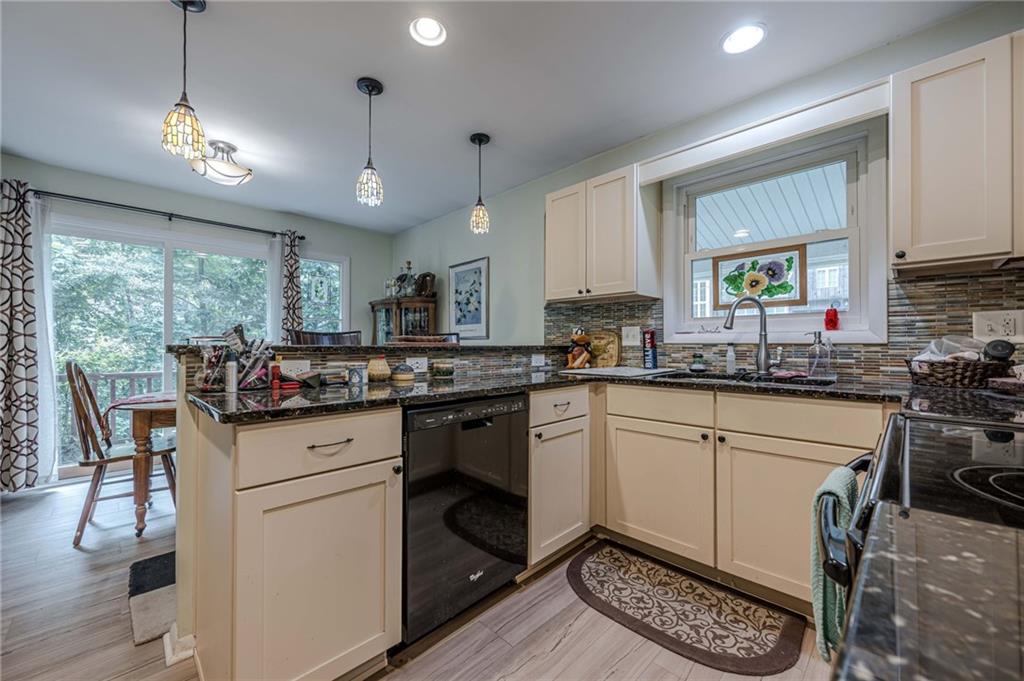 3671 Cold Spring Lane Atlanta, GA 30341 - Photo 6 of 26 a kitchen with granite countertop a sink appliances cabinets and furniture