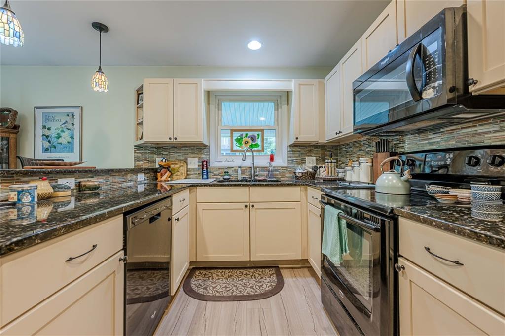3671 Cold Spring Lane Atlanta, GA 30341 - Photo 7 of 26 a kitchen with a sink stove and cabinets
