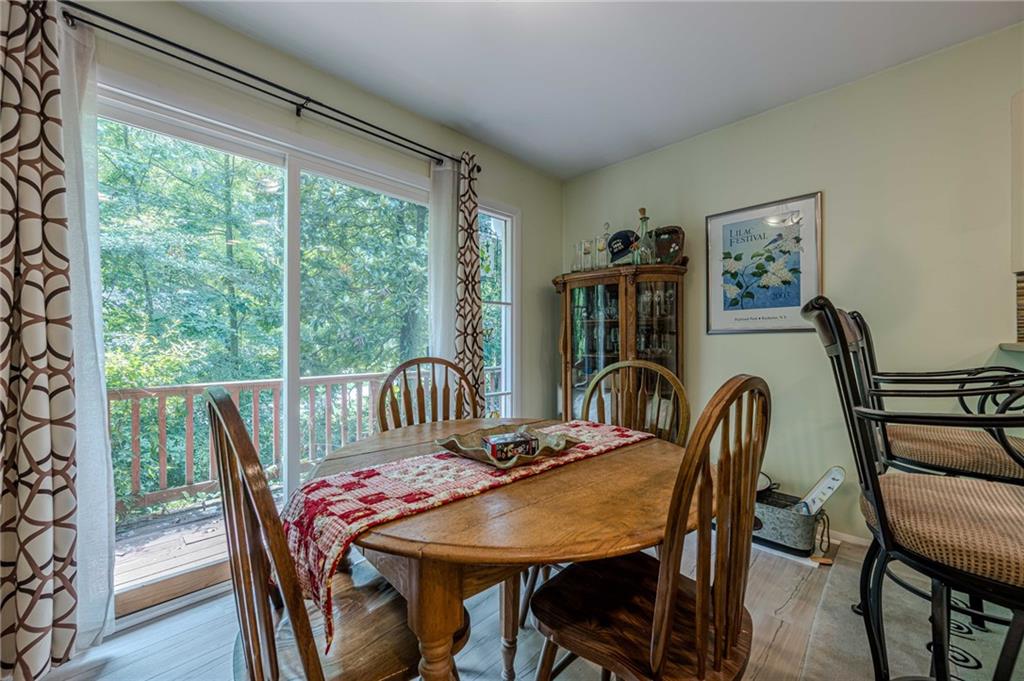 3671 Cold Spring Lane Atlanta, GA 30341 - Photo 8 of 26 a view of a dining room with furniture window and wooden floor