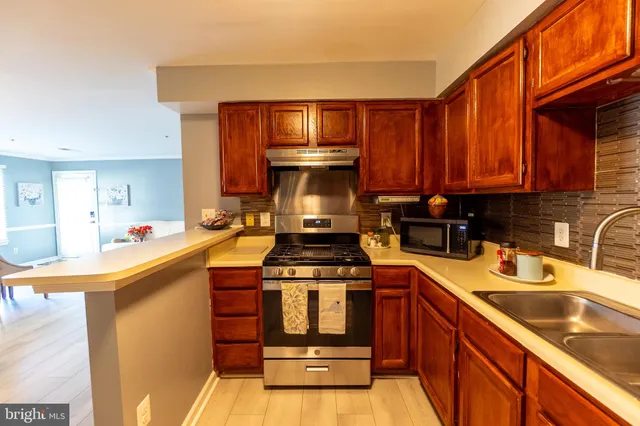 a kitchen with a stove and a sink