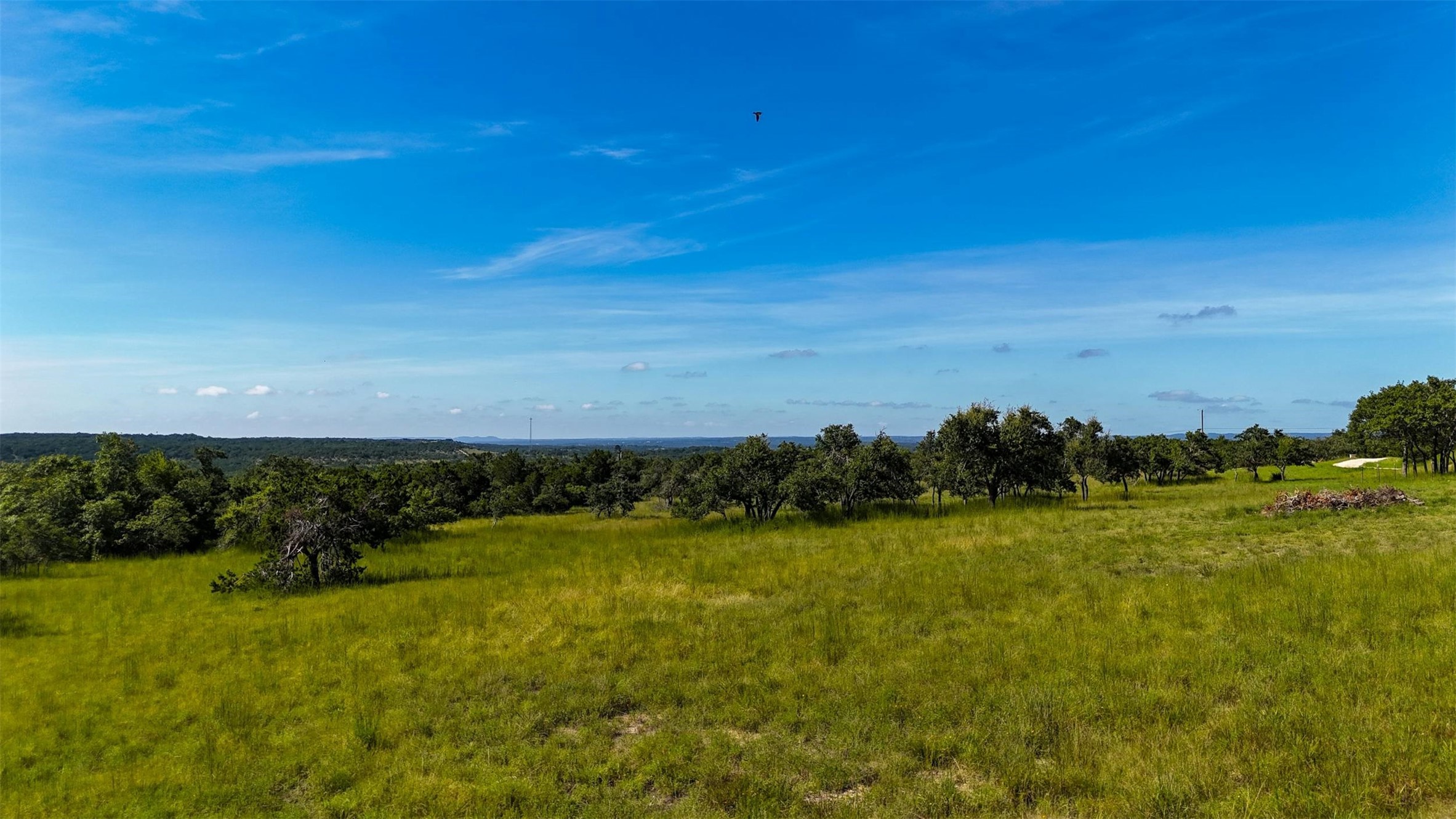 1215 Montell Road Wimberley, TX 78676 - Photo 16 of 38 a view of a lake with houses in the back