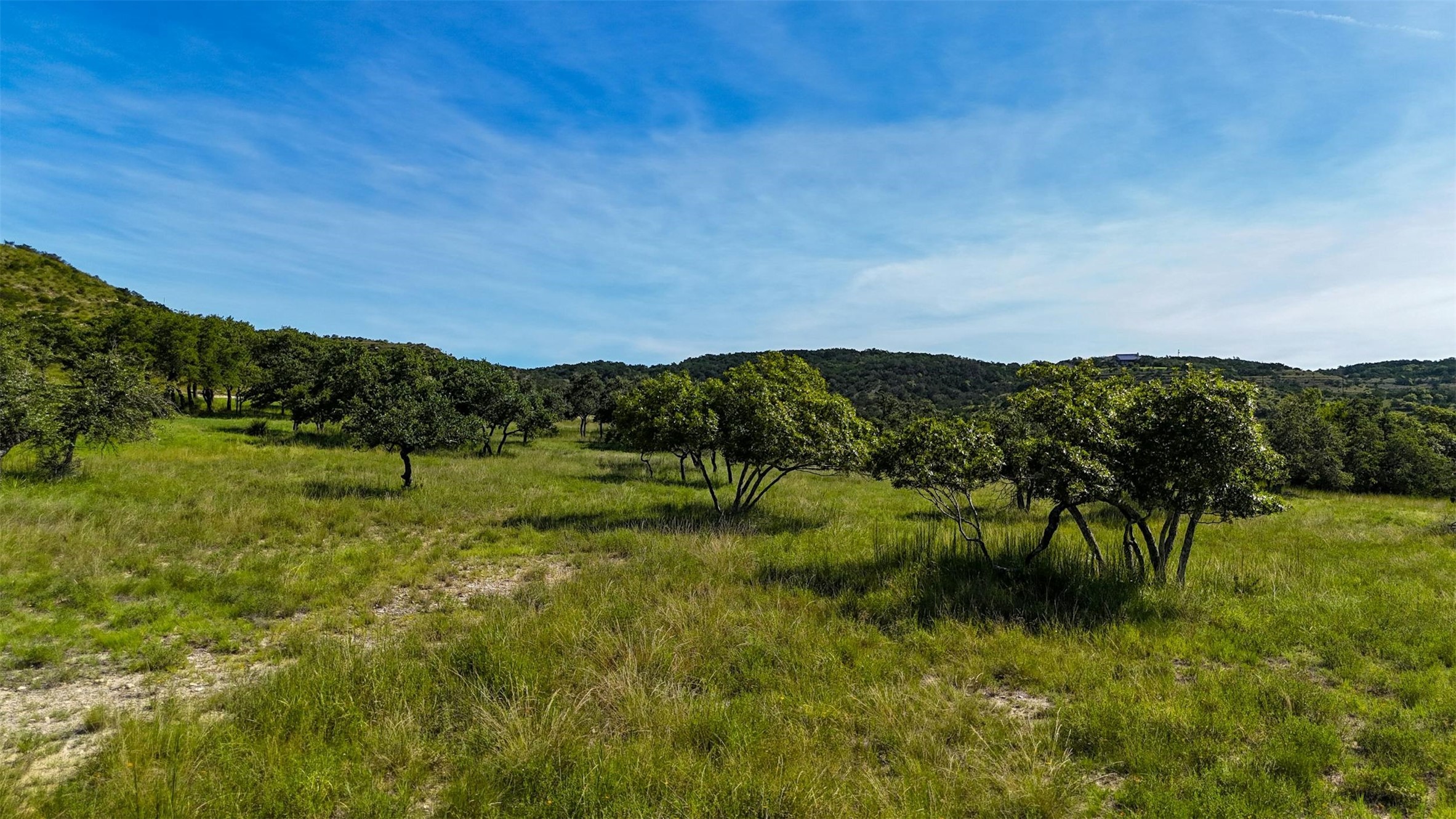 1215 Montell Road Wimberley, TX 78676 - Photo 19 of 38 a view of a lake with a city