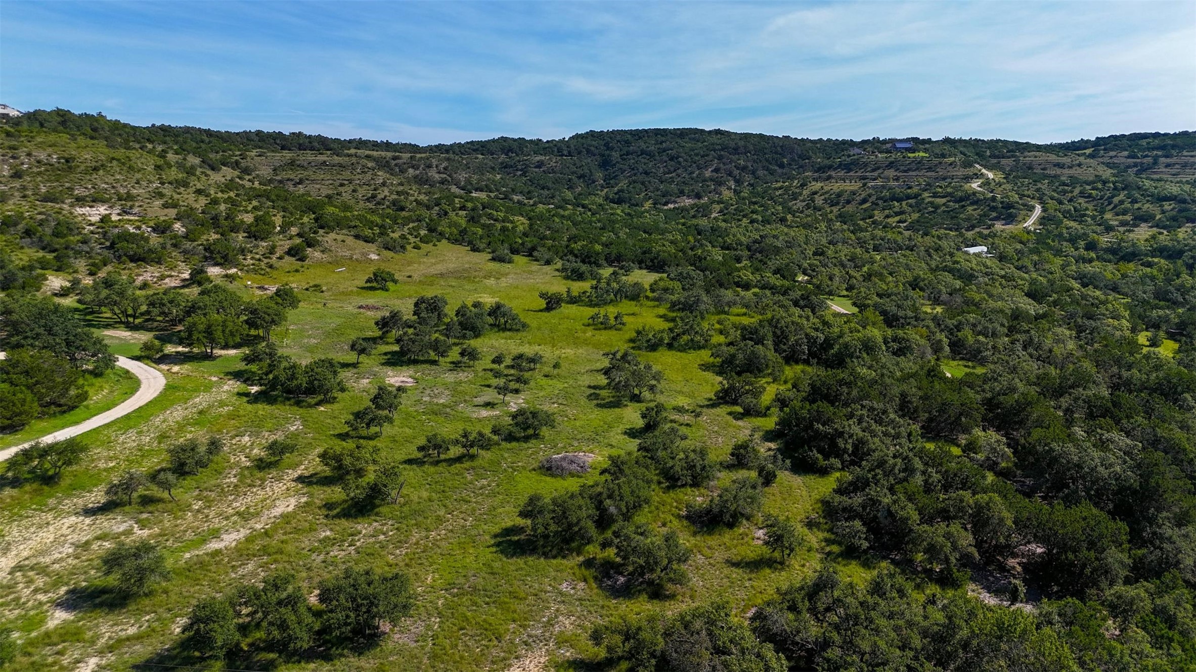 1215 Montell Road Wimberley, TX 78676 - Photo 22 of 38 a view of a city with mountains in the background