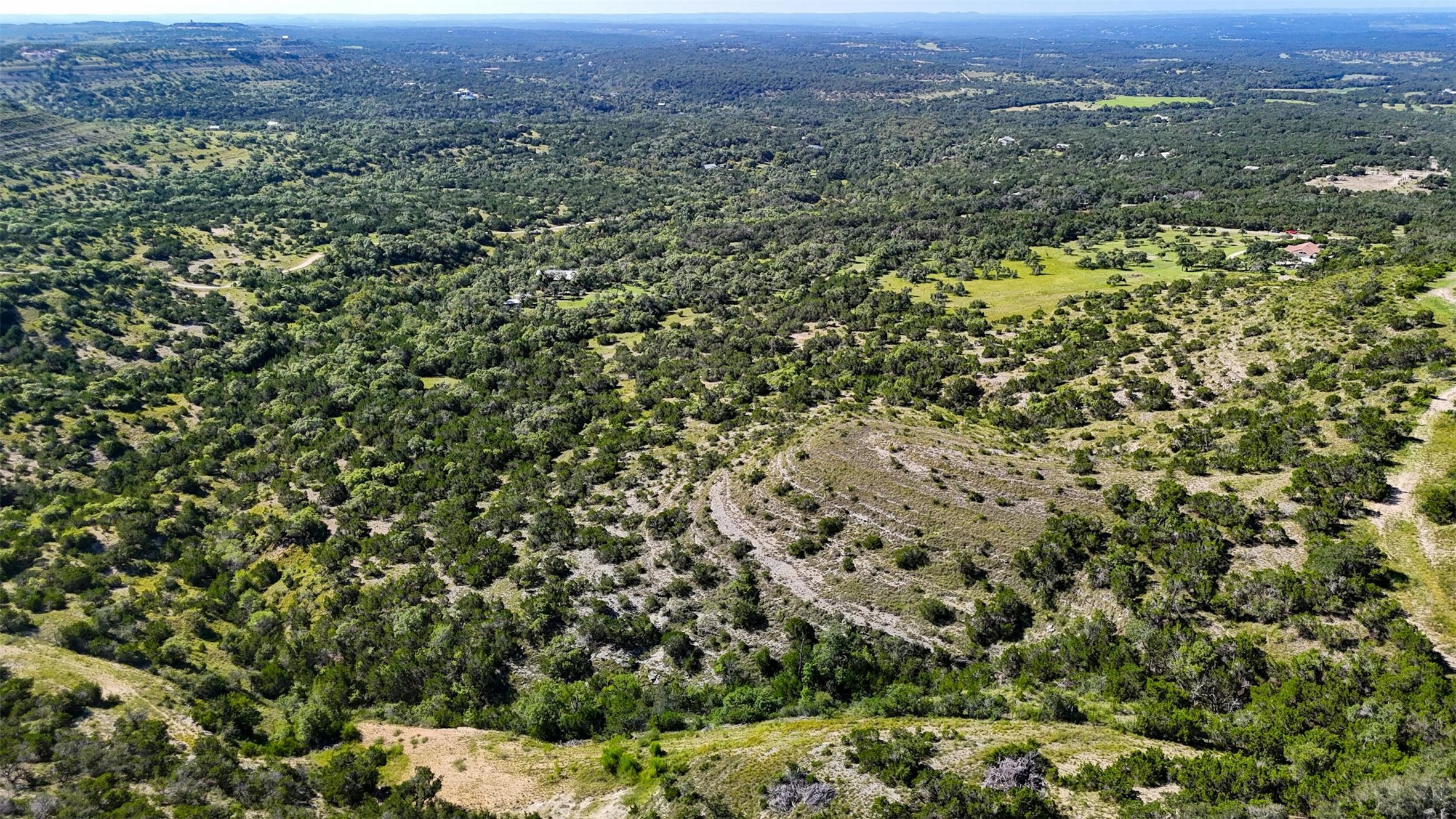 1215 Montell Road Wimberley, TX 78676 - Photo 30 of 38 an aerial view of a houses with a yard