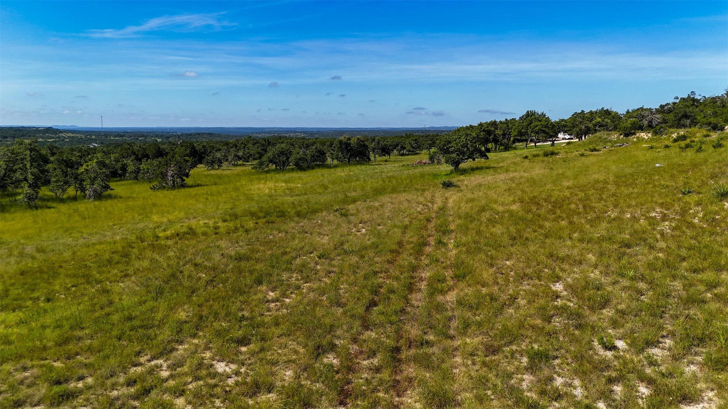 1215 Montell Road Wimberley, TX 78676 - Photo 7 of 38 a view of a field with an ocean