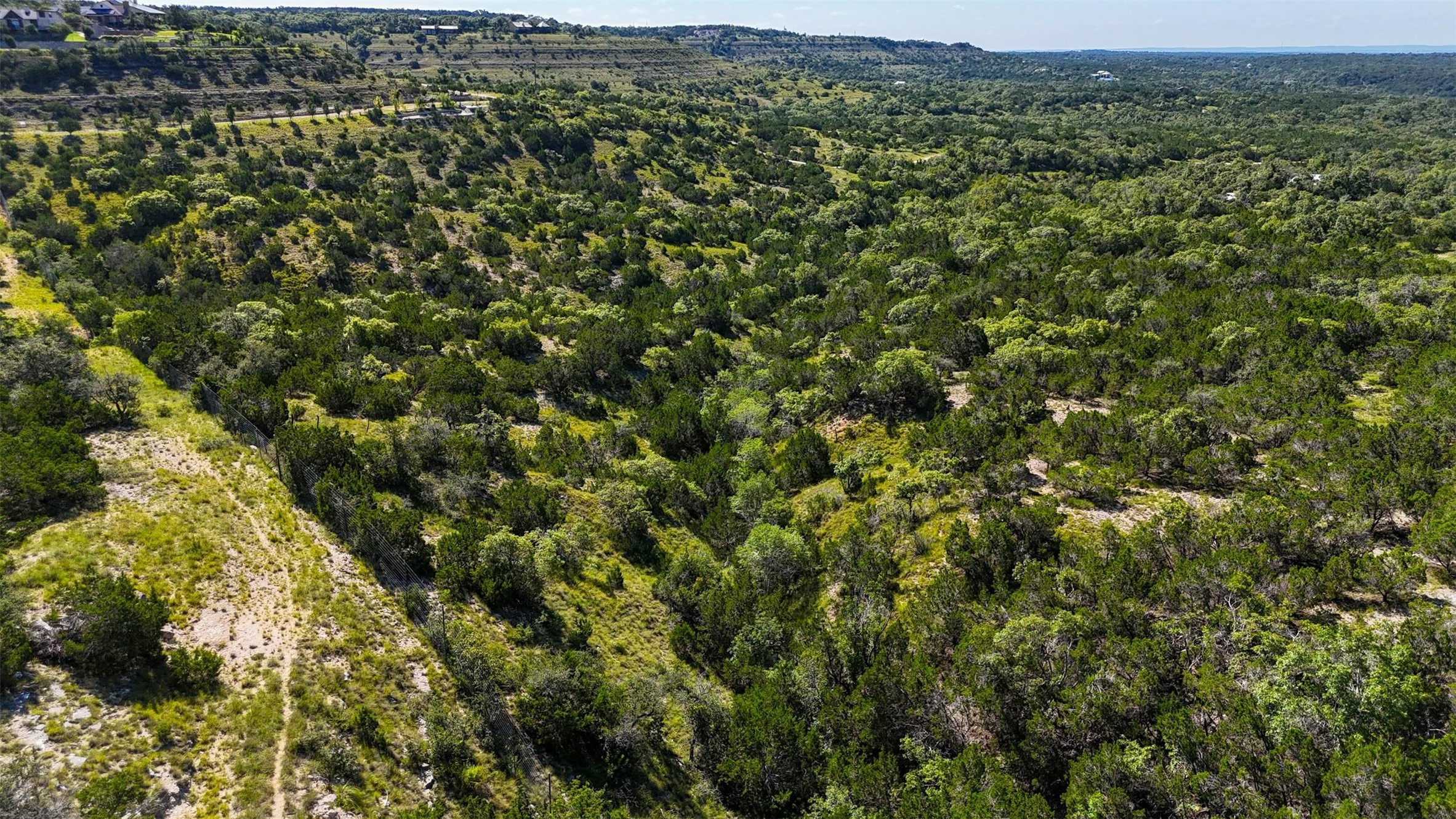 1215 Montell Road Wimberley, TX 78676 - Photo 9 of 38 a view of a green field