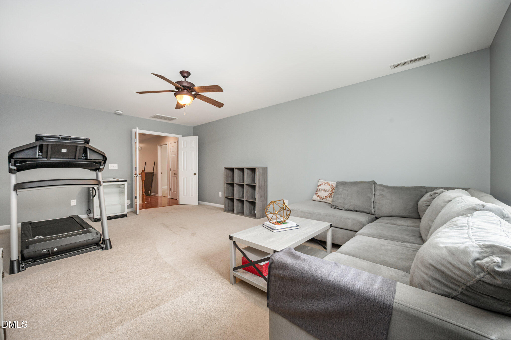2116 Covered Bridge Court Raleigh, NC 27614 - Photo 33 of 36 a living room with furniture a ceiling fan and a couch