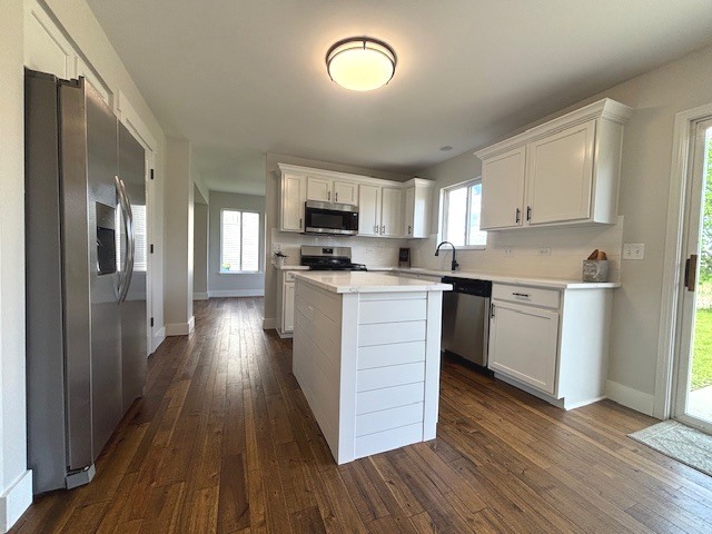 508 Ramsden Road Plano, IL 60545 - Photo 8 of 20 a kitchen with stainless steel appliances granite countertop a stove top oven a sink dishwasher and a refrigerator with wooden floor