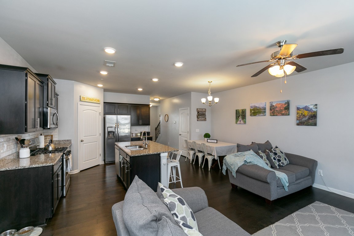 334 Manor Row Pleasant View, TN 37146 - Photo 6 of 38 a living room with lots of furniture and kitchen view