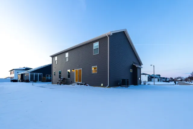 a view of house with yard and entertaining space