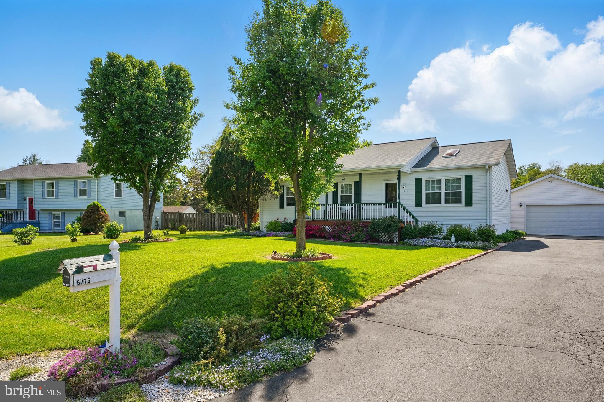 6775 Rugby Place Bealeton, VA 22712 - Photo 2 of 43 a view of a house with a swimming pool