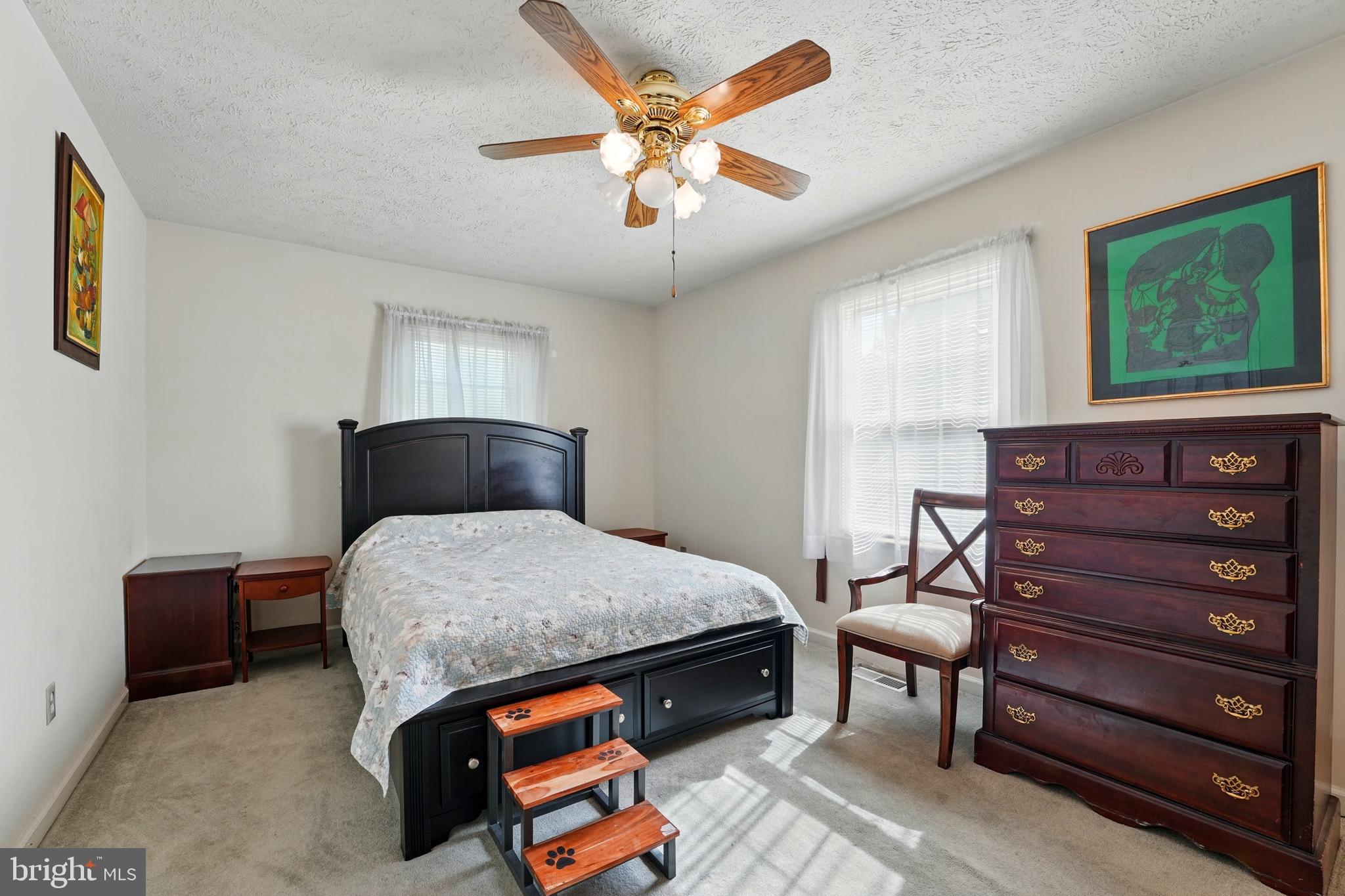 6775 Rugby Place Bealeton, VA 22712 - Photo 22 of 43 a bedroom with a bed and wooden floor