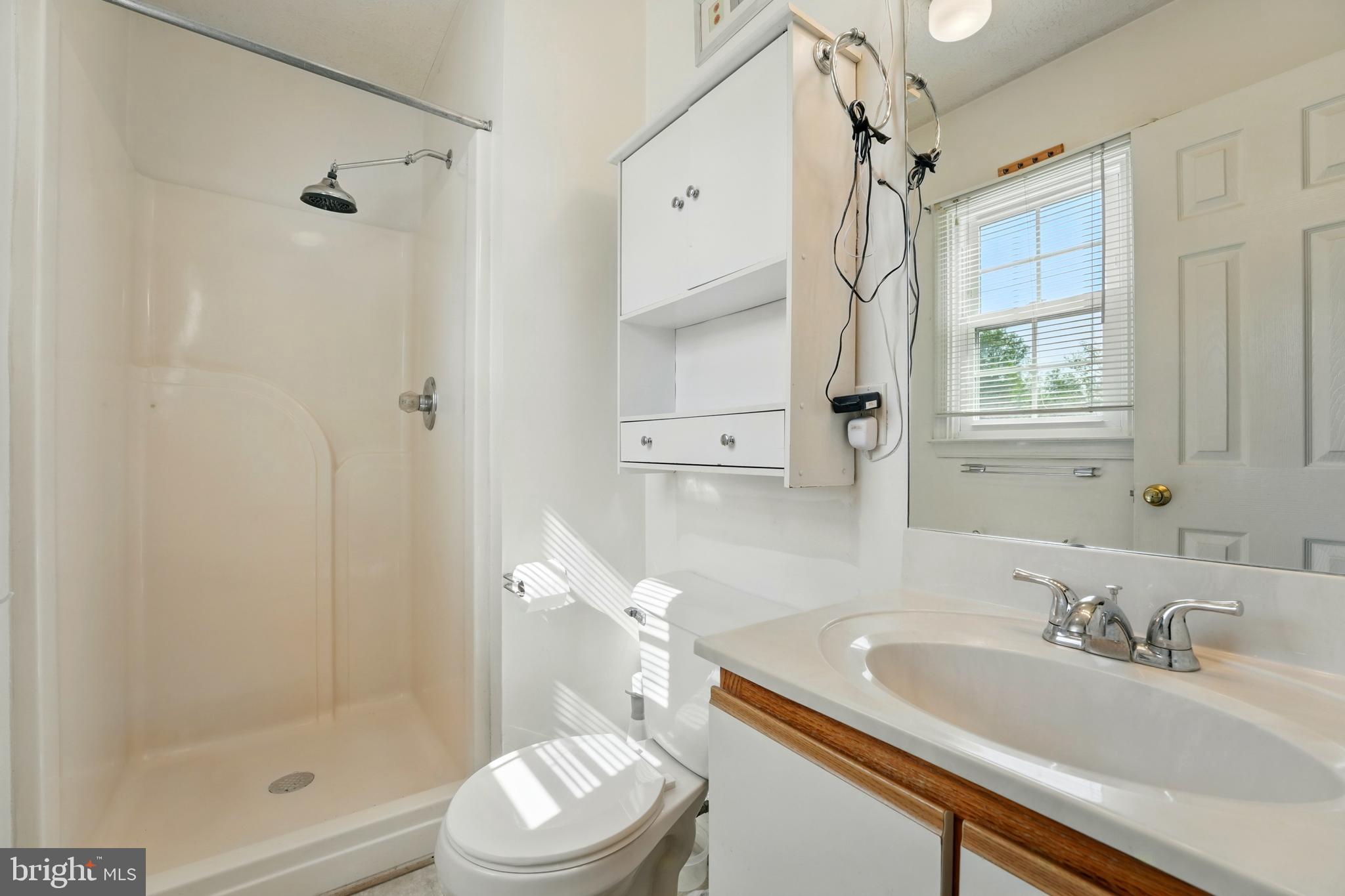 6775 Rugby Place Bealeton, VA 22712 - Photo 24 of 43 a bathroom with a granite countertop sink toilet and shower
