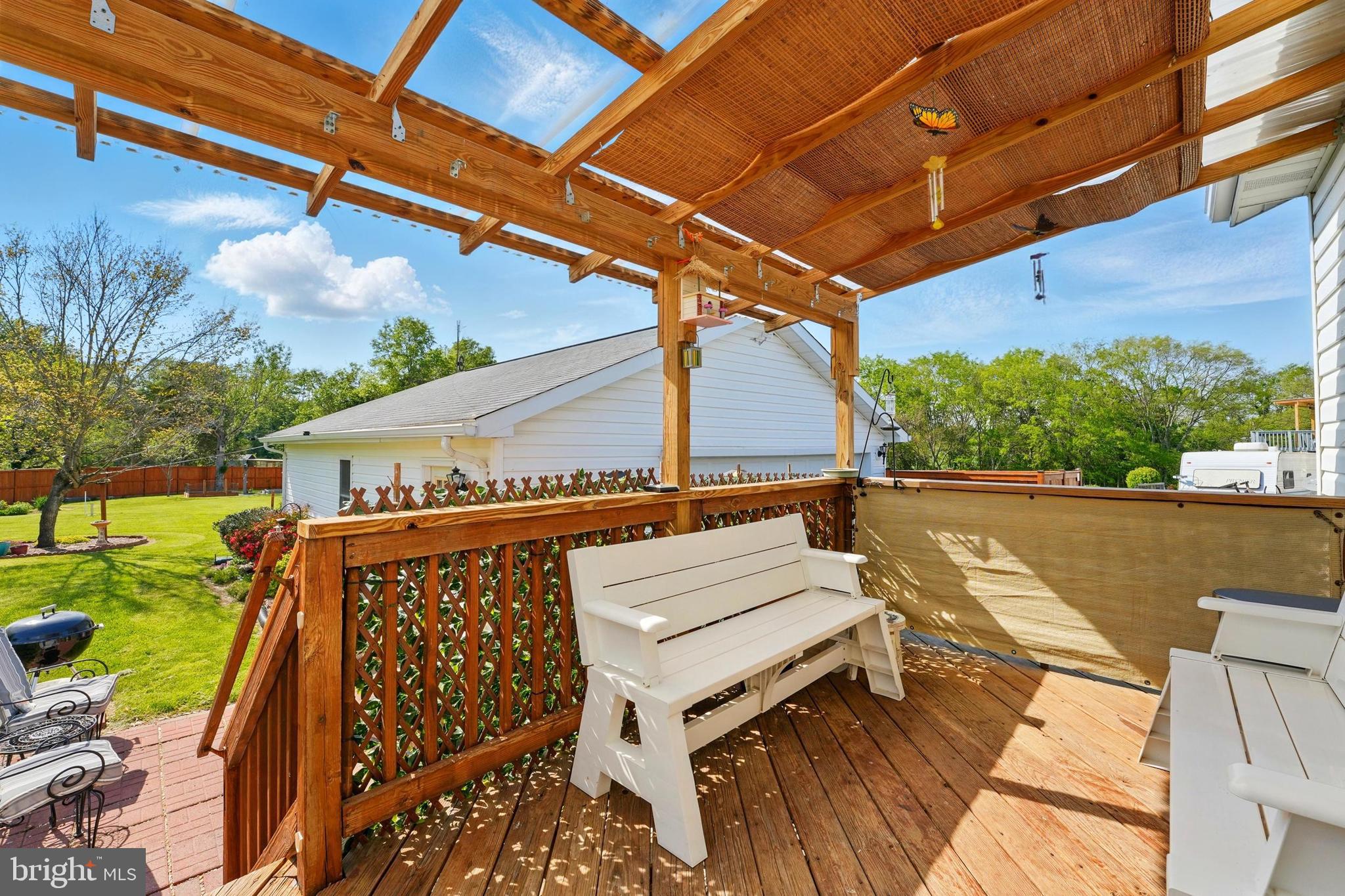 6775 Rugby Place Bealeton, VA 22712 - Photo 26 of 43 a view of a patio with a table and chairs