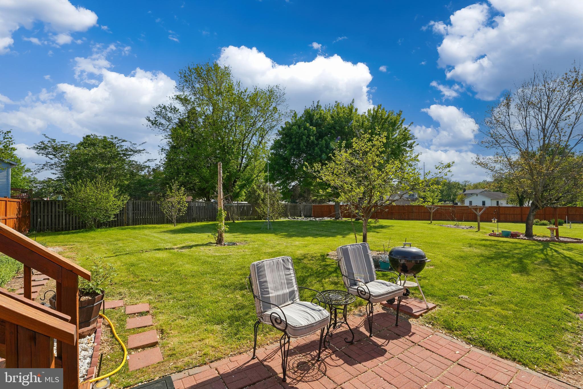 6775 Rugby Place Bealeton, VA 22712 - Photo 28 of 43 a view of a swimming pool and lounge chairs in back of the house