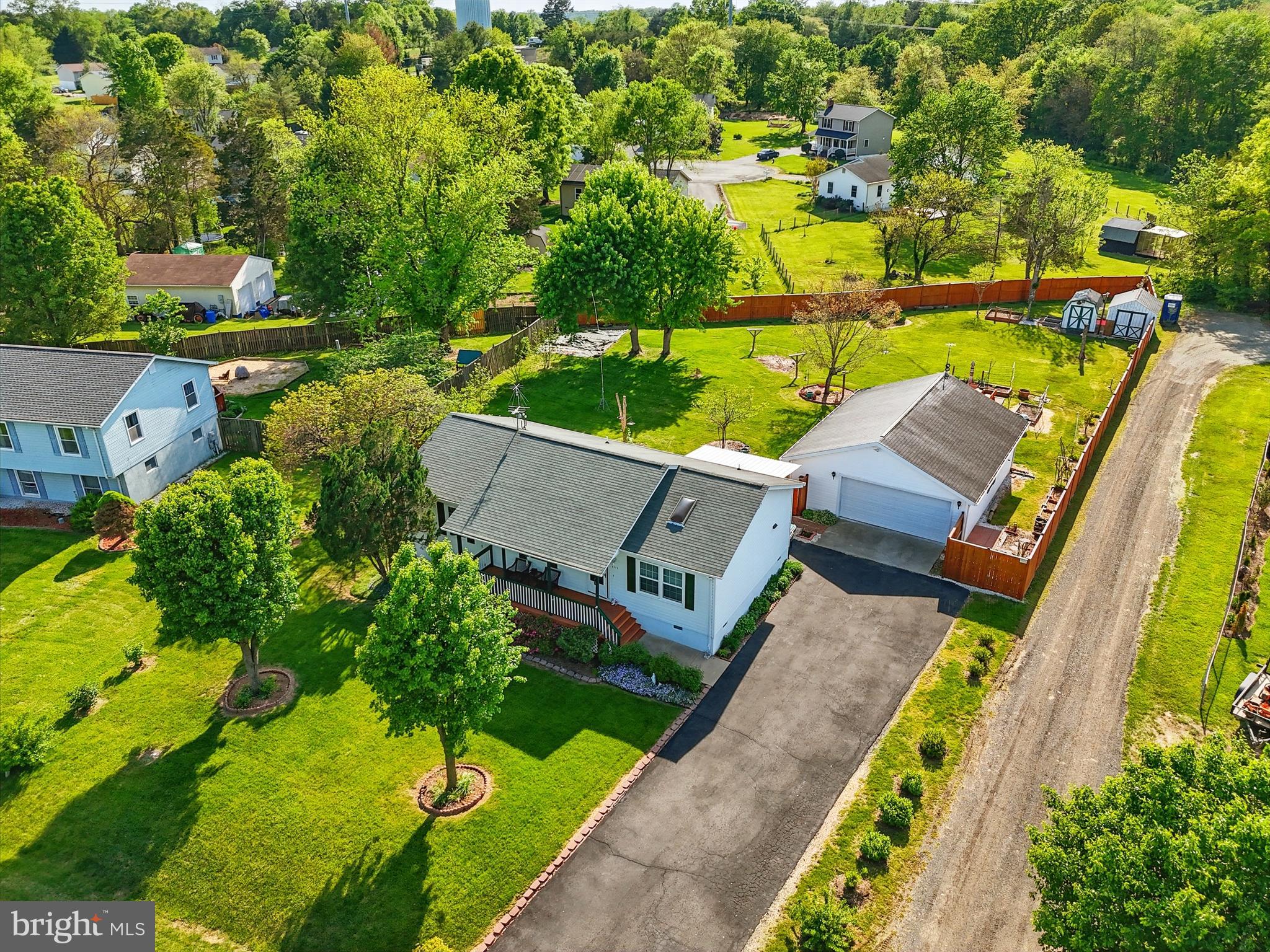 6775 Rugby Place Bealeton, VA 22712 - Photo 40 of 43 an aerial view of a house with a garden and swimming pool