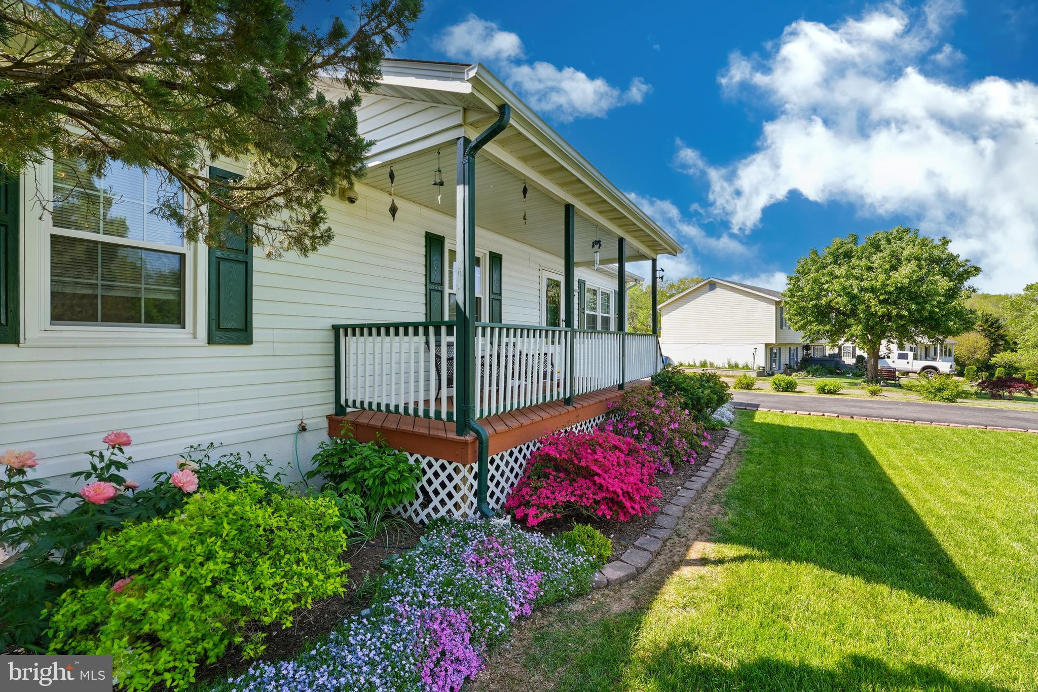 6775 Rugby Place Bealeton, VA 22712 - Photo 4 of 43 a view of a house with a yard and garden