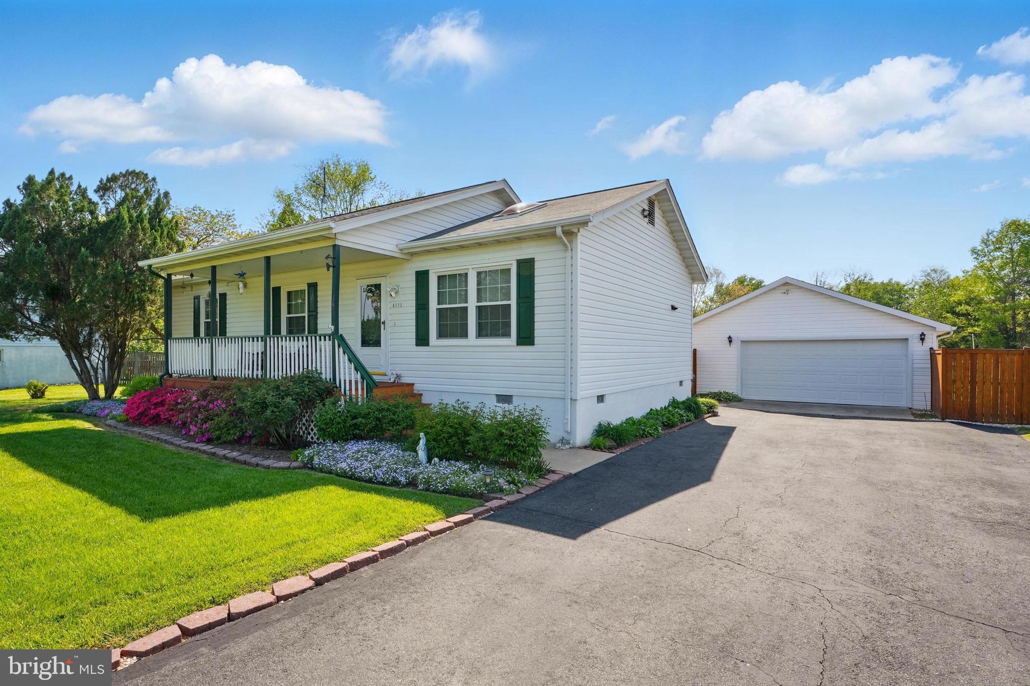 6775 Rugby Place Bealeton, VA 22712 - Photo 5 of 43 a front view of a house with garden